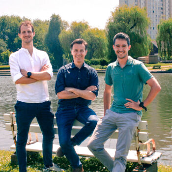 Senne, Kristof and Rud are posing in front of the Watersportbaan
